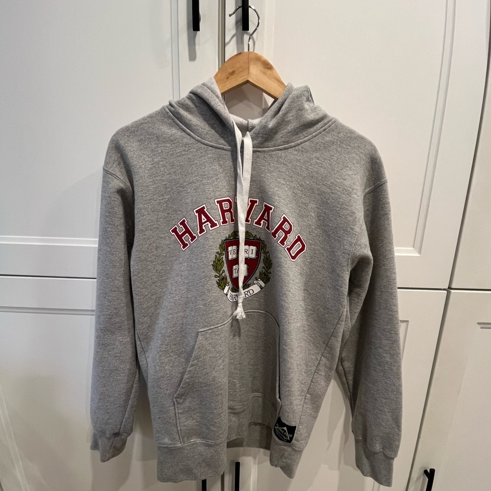 Grey hoodie with Harvard design including logo on front. From Camp Connection